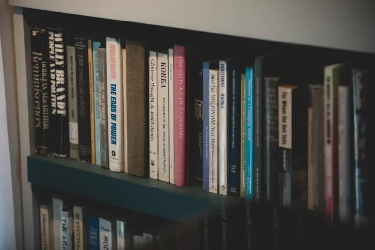 A close-up of a bookshelf filled with diverse books on various subjects, ideal for education and study